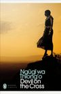 Text: "Ngũgĩ wa Thiong'o Devil on the Cross" und "Modern Classics". Eine Frau steht seitlich auf einem Felsen bei Sonnenuntergang.