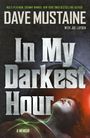 „In My Darkest Hour“ ist in großer Schrift zu sehen. Eine Person mit Maske blickt nach oben, eingehüllt in ein geheimnisvolles Licht.