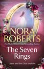 "NORA ROBERTS - The Seven Rings. Leave and live. Stay and die." Goldener Rahmen mit Blumen, Frau im weißen Kleid.