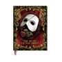 "The Music of the Night" steht auf einem roten Hintergrund mit goldenen Verzierungen, Maske und Rose in der Mitte.