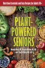"Plant-Powered Seniors" in großen, grünen Buchstaben, mit frischem Gemüse auf Holzuntergrund drapiert.