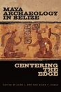 Texte: "Maya Archaeology in Belize", "Centering the Edge". Illustration: Zwei dekorierte Figuren in traditioneller Kleidung.