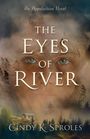 "The Eyes of River", ein Gesicht mit grünen Augen über nebeligem Wald und Hütte, Text: Cindy K. Sproles.