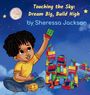 "Touching the Sky: Dream Big, Build High" von Sheressa Jackson. Kind baut mit bunten Bauklötzen unter einem Nachthimmel.