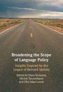 „Broadening the Scope of Language Policy“ steht über einem Highway in einer Landschaft.