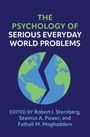 "The Psychology of Serious Everyday World Problems" Buchcover mit einem gespaltenen Globus-Design.