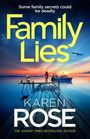 "Some family secrets could be deadly. Family Lies, Karen Rose. Eine Person auf einem Steg, mit Boot in einem ruhigen Gewässer."