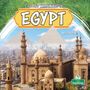 Text: "Life and Traditions in Egypt", "Arthur Yazdani". Stadtansicht mit Moschee und Pyramiden im Hintergrund. 