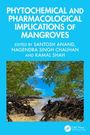 “Phytochemical and Pharmacological Implications of Mangroves”, rote Wurzeln und blaues Meer unter klarem Himmel.