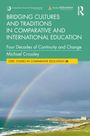 Buchtitel: „Bridging Cultures and Traditions in Comparative and International Education“ von Michael Crossley. Regenbogen über Küste.