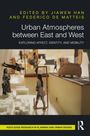 Titel: Urban Atmospheres between East and West. Miniaturstadt mit Figuren und Autos in warmen Farbtönen.