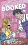 Text: "All BOOKED Up", "S.H. EASTON". Illustration: Frau und Mann in Café, hält Tasse, Bücher im Hintergrund.