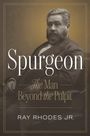 "Spurgeon: The Man Beyond the Pulpit" von Ray Rhodes Jr. zeigt einen Mann im Anzug, sitzend, mit einem ernsten Ausdruck.