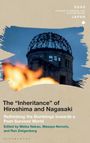 "The 'Inheritance' of Hiroshima and Nagasaki" vor zerstörtem Gebäude, Flammen im Vordergrund, Himmel im Hintergrund.