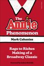 Text: "The Annie Phenomenon", "Mark Cabaniss", "Rags to Riches Making of a Broadway Classic", "Foreword by Andrea McArdle". 
Rote Illustration mit weißem Kragenmotiv.
