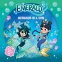 Text: "EMERALD", "MERMAIDS IN A SPIN", "AS SEEN ON TV!". Illustration: Zwei freundliche Meerjungfrauen mit bunten Flossen.