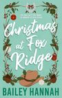 "THE ONLY GIFT THEY WANT TO UNWRAP IS EACH OTHER... Christmas at Fox Ridge. BAILEY HANNAH." Festlich dekoriert mit Zweigen und einem Cowboyhut.