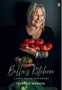 "Bella's Kitchen: A South African Food Odyssey. Isabella Niehaus." Ältere Frau hält strahlend Tomaten, elegantes Outfit.