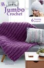 "Jumbo Crochet", "6 Stunning projects!", "Lisa Gentry". Dicke lila Decke und graues Kissen auf einem Sofa.
