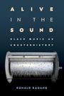 "ALIVE IN THE SOUND: BLACK MUSIC AS COUNTERHISTORY. RONALD RADANO." Eine Walze mit Stiften und Zahnrädern.