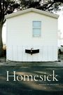"Homesick" oben, "Nicholas Shapiro" unten. Ein kleines weißes Haus mit einem Fenster, zwei Bäume im Hintergrund.