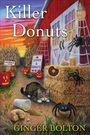 Texte: "Killer Donuts", "Cider & Donuts", "Entrance", "A Deputy Donut Mystery", "Ginger Bolton". Illustration: Katze, Spinnen, Kürbisse.
