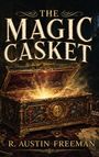 "The Magic Casket" und "R. Austin Freeman". Eine geöffnete, reich verzierte Truhe strahlt goldenes Licht aus.