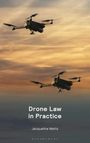 Text: "Drone Law in Practice" von Jacqueline Watts. Zwei Drohnen fliegen vor einem orange-grauen Himmel.
