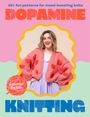 „20+ fun patterns for mood-boosting knits. DOPAMINE KNITTING. Lauren Aston.“ Frau in rosa Strickjacke mit roten Herzen.