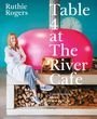 Text: "Ruthie Rogers. Table 4 at The River Cafe. Conversations about Food and Life." Frau sitzt lächelnd auf Holztisch vor Ofen.