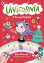 "Unicornia: A Snowy Surprise." Ein Mädchen mit lila Haaren pustet Schneeflocken, umgeben von Geschenken; bunter Hintergrund.