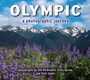 „OLYMPIC“ und „a photographic journey“. Im Vordergrund blühende violette Blumen, dahinter schneebedeckte Berge und blauer Himmel.