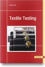 „Textile Testing“ von Dieter Veit. Rotes Cover, Bild von Maschinen mit Ketten und stacheligen Kugeln.