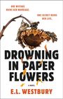 Text: "One mistake ruins her marriage. One secret ruins her life. Drowning in Paper Flowers. A Novel by E.L. Westbury."  
Ein welkes Sonnenblumenkopf.