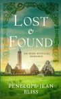 Text: "Lost & Found", "An Irish Mystical Romance", "Penelope Jean Bliss". Alte irische Klosterruinen auf grüner Wiese.