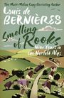 Buchtitel: "Smelling of Rooks: Nine Years in the Norfolk Alps" von Louis de Bernières. Illustration einer ländlichen Landschaft mit Feldern und Häusern.