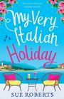 „The perfect feel good romantic comedy. My Very Italian Holiday. Sue Roberts.“ Zwei Sessel mit Tisch am See, Blumen oben.
