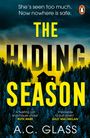 Text: "She’s seen too much. Now nowhere is safe. THE HIDING SEASON A.C. GLASS." Waldsilhouette vor gelbem Himmel.