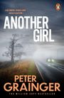 "Another Girl" in großen weißen Lettern, darunter "Peter Grainger". Neblige Landstraße mit scheinendem Auto und kahlen Bäumen.