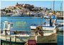 Text: "IBIZA + Formentera", "2027", "CASARES EDITION". Fischerboote im Hafen, dahinter eine hügelige Stadtlandschaft.