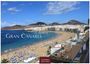 Text: "Gran Canaria", "2027", "Casares Edition". Strand mit vielen Menschen, Sonnenschirmen, klar blauem Meer und Bergen im Hintergrund.