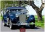 Text: "Mercedes Classic Cars", "2027", "CASARES EDITION". Altes dunkelblaues Auto auf Landstraße, Bäume im Hintergrund.
