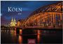 Text: Köln 2027. Nachtansicht einer beleuchteten Brücke und dem Dom im Hintergrund unter einem dunklen Himmel.