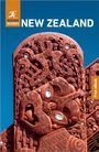 "Rough Guides NEW ZEALAND Free eBook." Rotes, reich verziertes, traditionelles Maori-Holzschnitzwerk vor klarem, blauem Himmel.