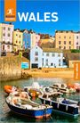 "Rough Guides WALES, Free eBook" steht auf einem Bild einer Küstenstadt mit bunten Häusern und Booten im Vordergrund.