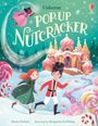 Text: "Usborne Pop-Up Nutcracker." Ein Mädchen und ein Junge laufen, umgeben von Süßigkeiten und Schneeflocken. 
