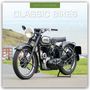 "2027 CALENDAR", "CLASSIC BIKES" oben. Ein klassisches Motorrad auf einem Weg, im Hintergrund grüne Hügel.