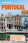 "Portugal’s best beaches, Historic Lisbon guide, Douro’s wine scene." Historische Gebäude an einem Fluss, blauer Himmel.