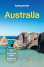 Text oben: "lonely planet". Groß: "Australia".  
Im Vordergrund klarem Wasser und Felsen. Person in roter Badebekleidung.