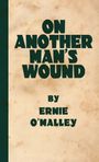 "ON ANOTHER MAN'S WOUND" von Ernie O’Malley in großen, grünen Buchstaben auf beigem Hintergrund.